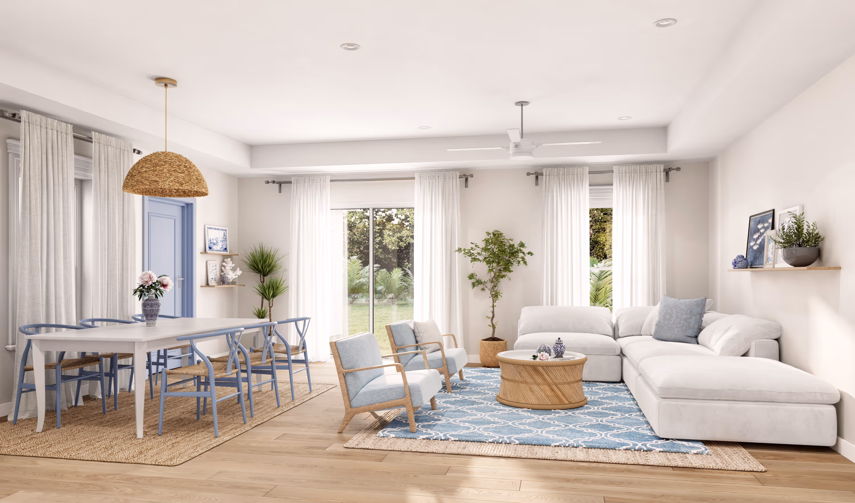 Bright living room with white sectional sofa, blue chairs, wooden table, and large windows with white curtains.