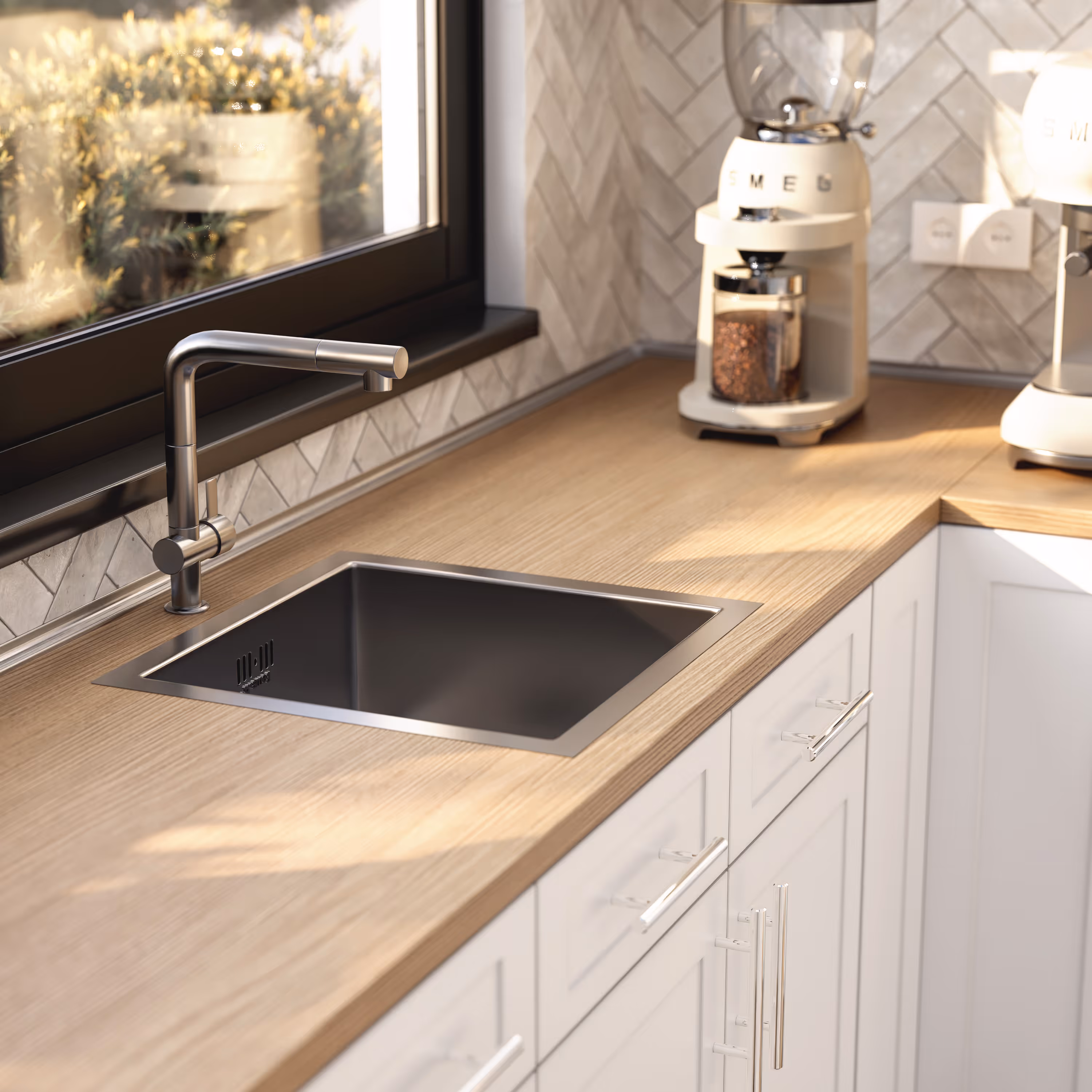 Modern kitchen countertop with a stainless steel sink, faucet, and a coffee grinder by the window.