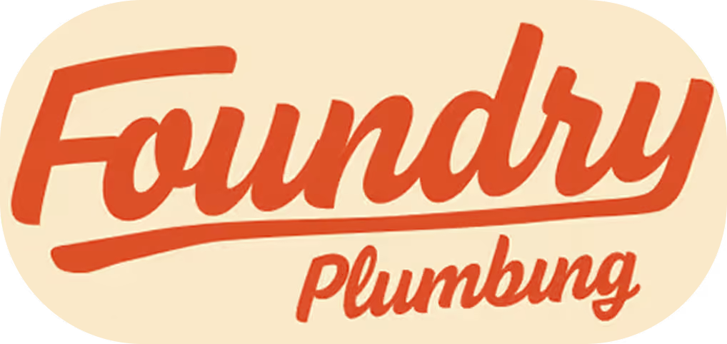 Foundry Plumbing logo with red cursive text on beige oval background.