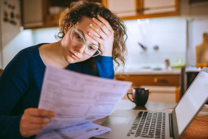 A woman worried about her bills and wanting to get out of her mortgage.