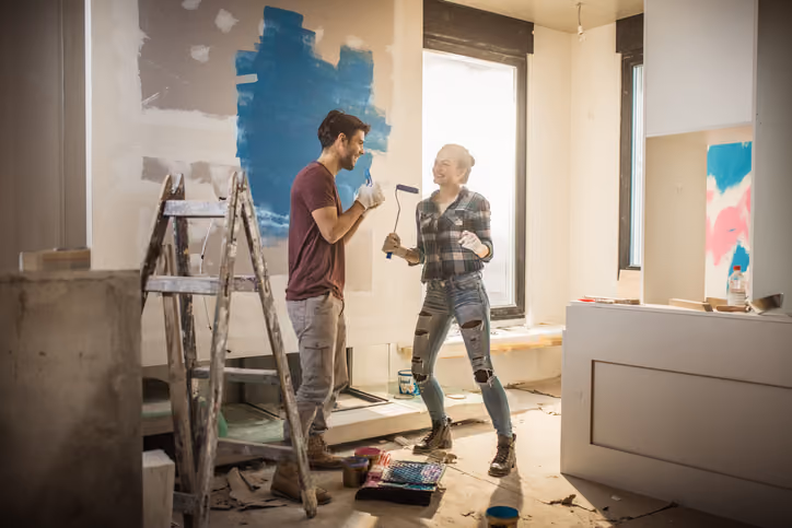 A young couple fixing up their home and wanting to sell their home without making repairs.
