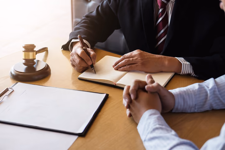 Man filling out paperwork to sell a house before probate.