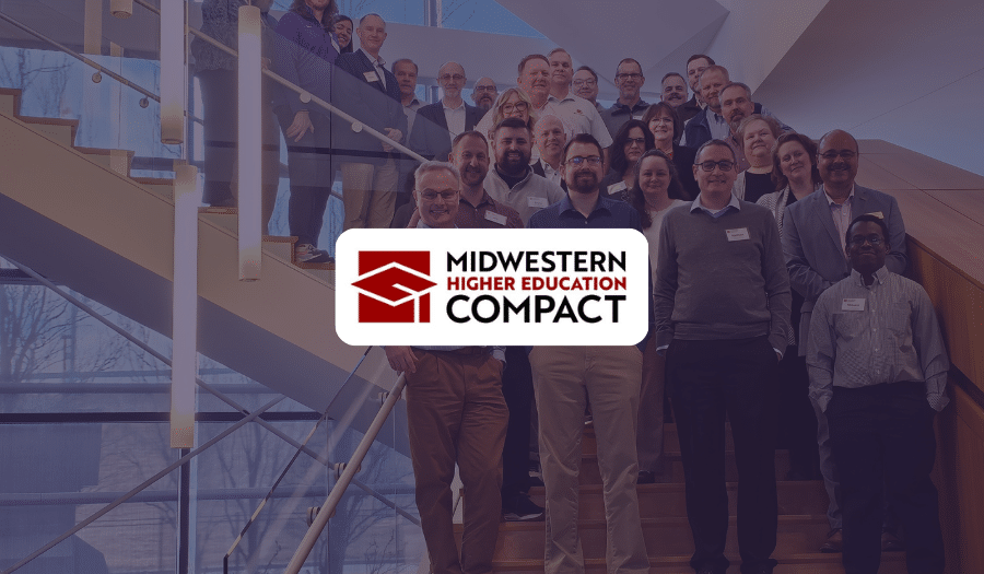 Midwestern Higher Education Compact logo over a group photo of delegates on a staircase