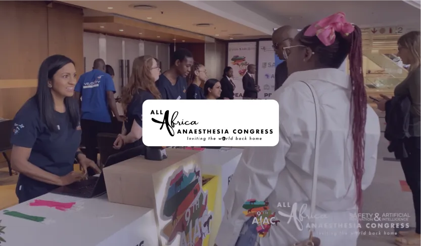 All Africa Anaesthesia Congress logo over attendees checking in at the registration desk