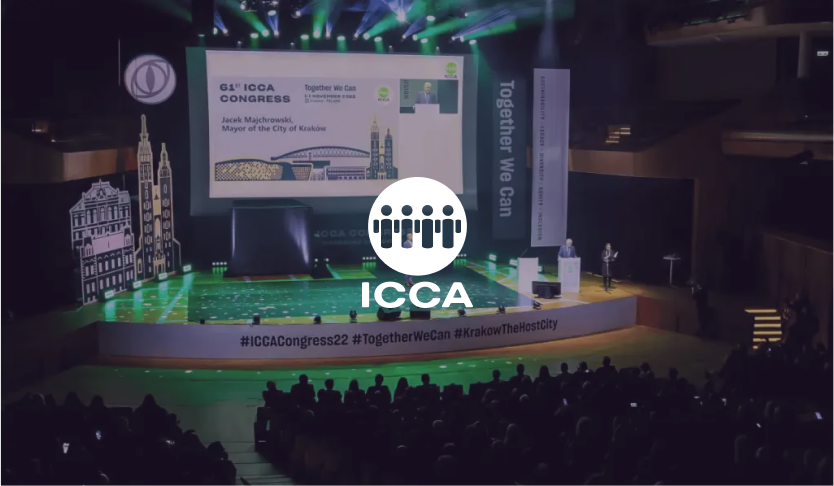 ICCA logo over the 61st ICCA Congress main stage with a green-lit set and audience