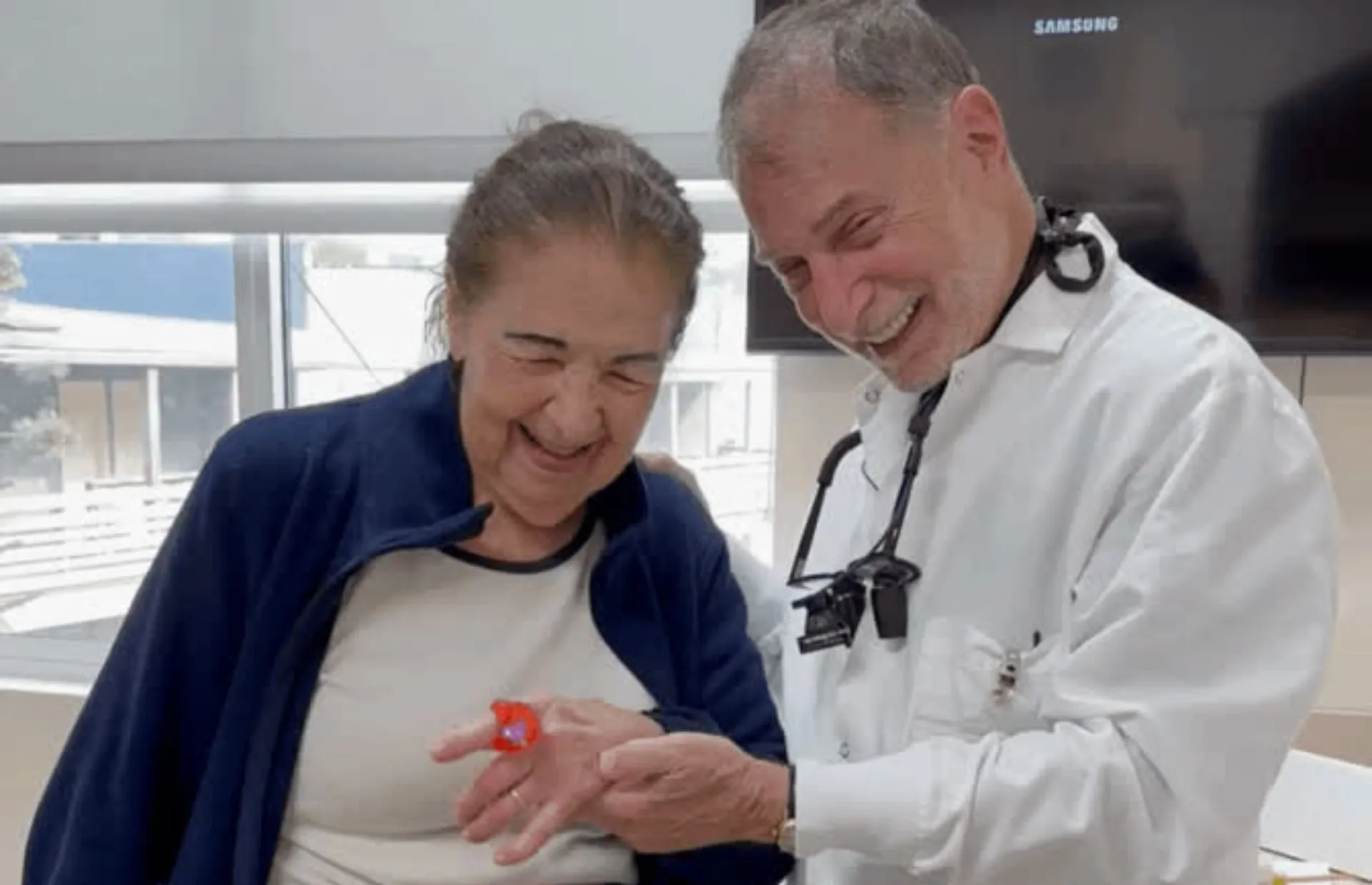 Stamford, CT dentist sharing a positive dental moment with a smiling patient.