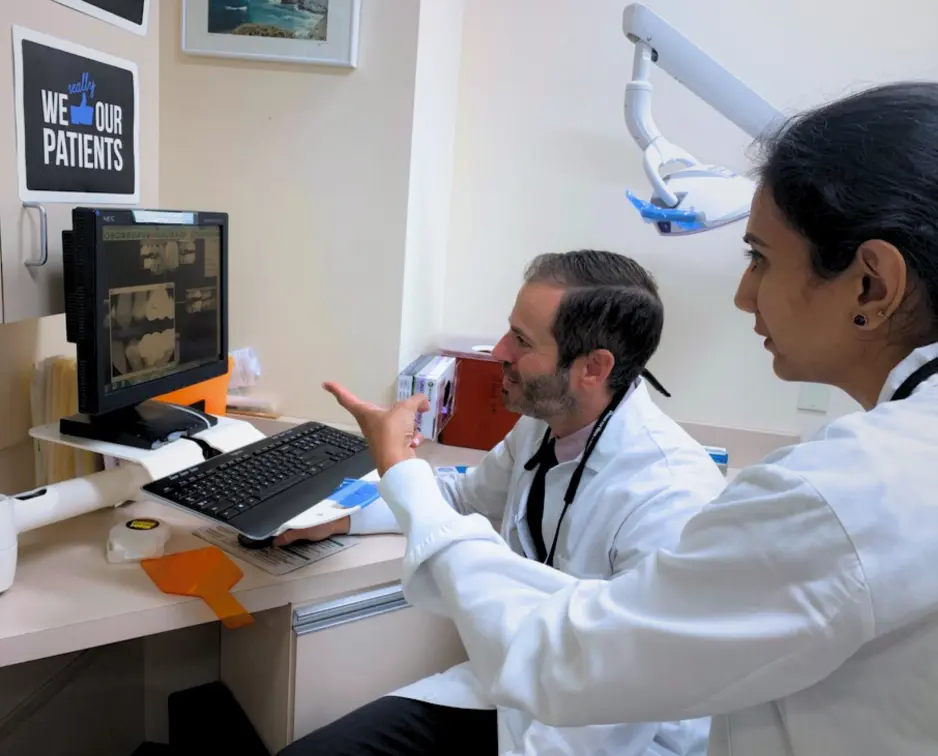 Dental Care Stamford dentists are reviewing digital dental images to plan personalized treatment in Stamford, CT.