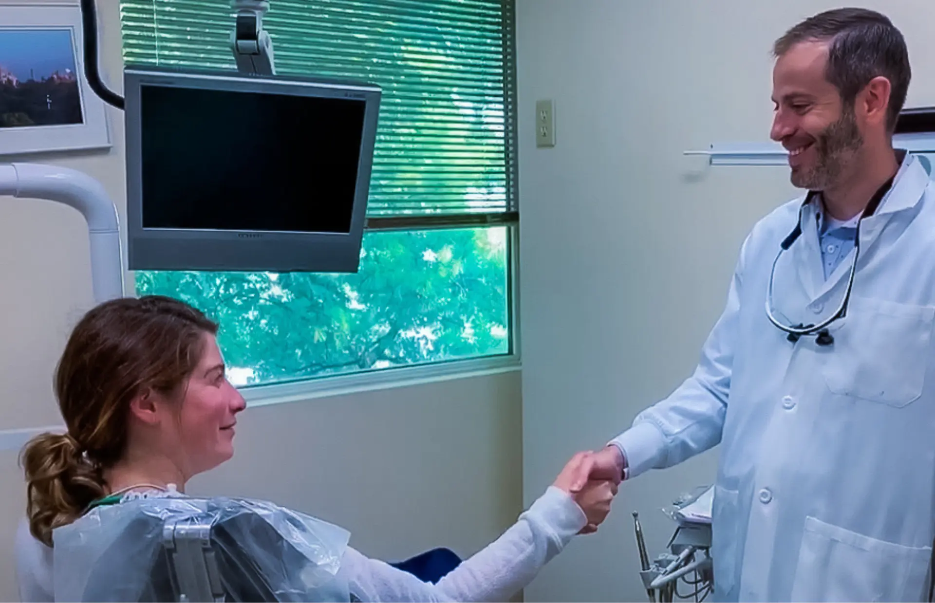 Dental Care Stamford dentist speaking with a patient about whether cosmetic dentistry may be right for their smile goals.