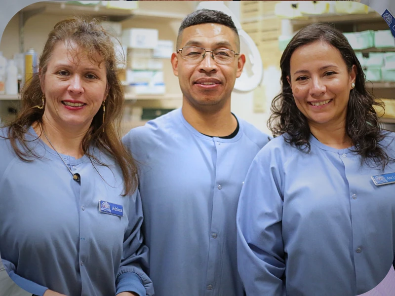 Dental Care Stamford team members smiling together, representing compassionate, coordinated dental care in Stamford, CT.