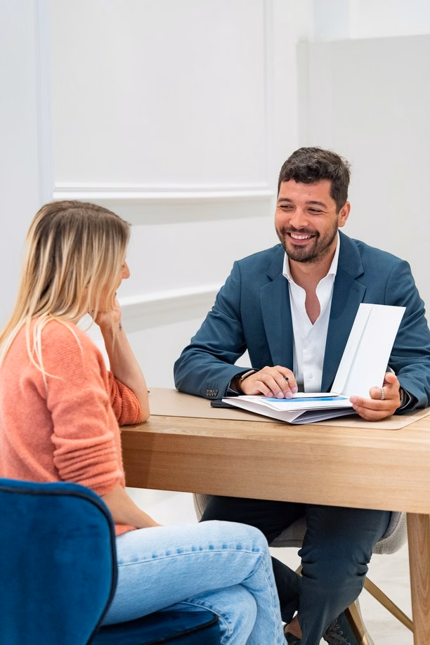 Pedro, Life Properties advisor, presenting a property to a client at the agency