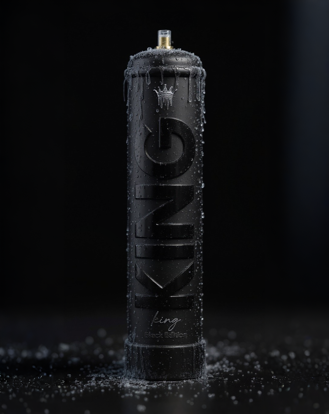 Black spray paint can labeled 'KING Black Edition' with water droplets and condensation on it, set against a dark background with scattered water droplets on the surface.