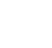 Three people seated at a table with a gear symbol above representing teamwork or collaboration.
