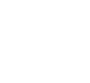 Three people sitting around a table with a large gear and light bulb icon above them representing teamwork.