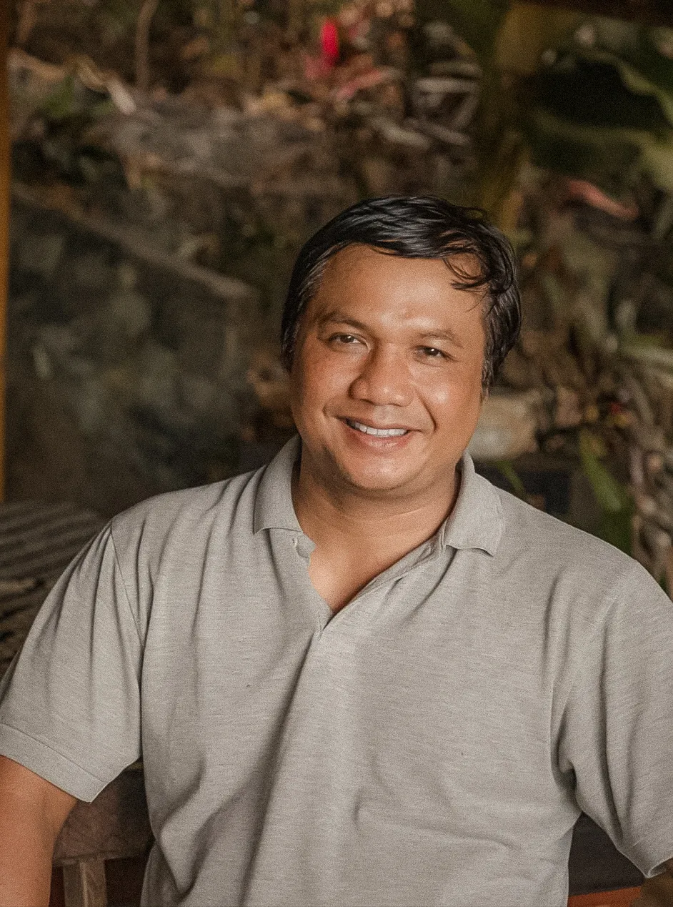 Joko, a holistic healing massage practitioner with 27 years of experience, offering traditional healing treatment at Balquisse Heritage Hotel