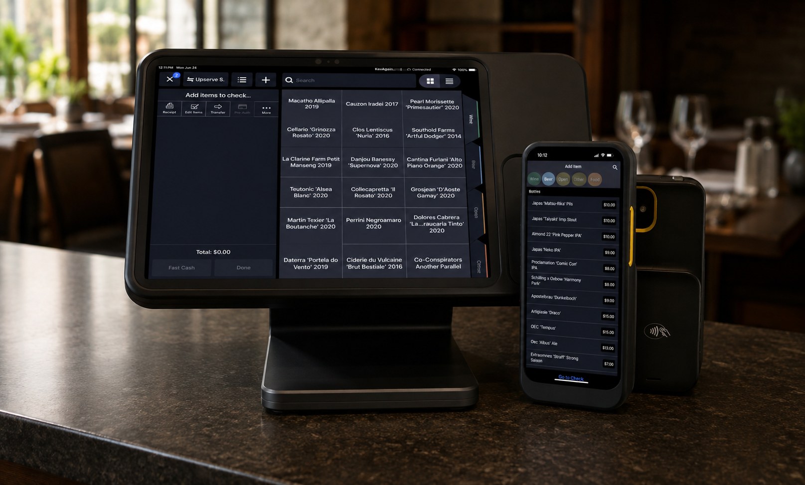 Upserve POS terminal, handheld, and card reader on a restaurant bar