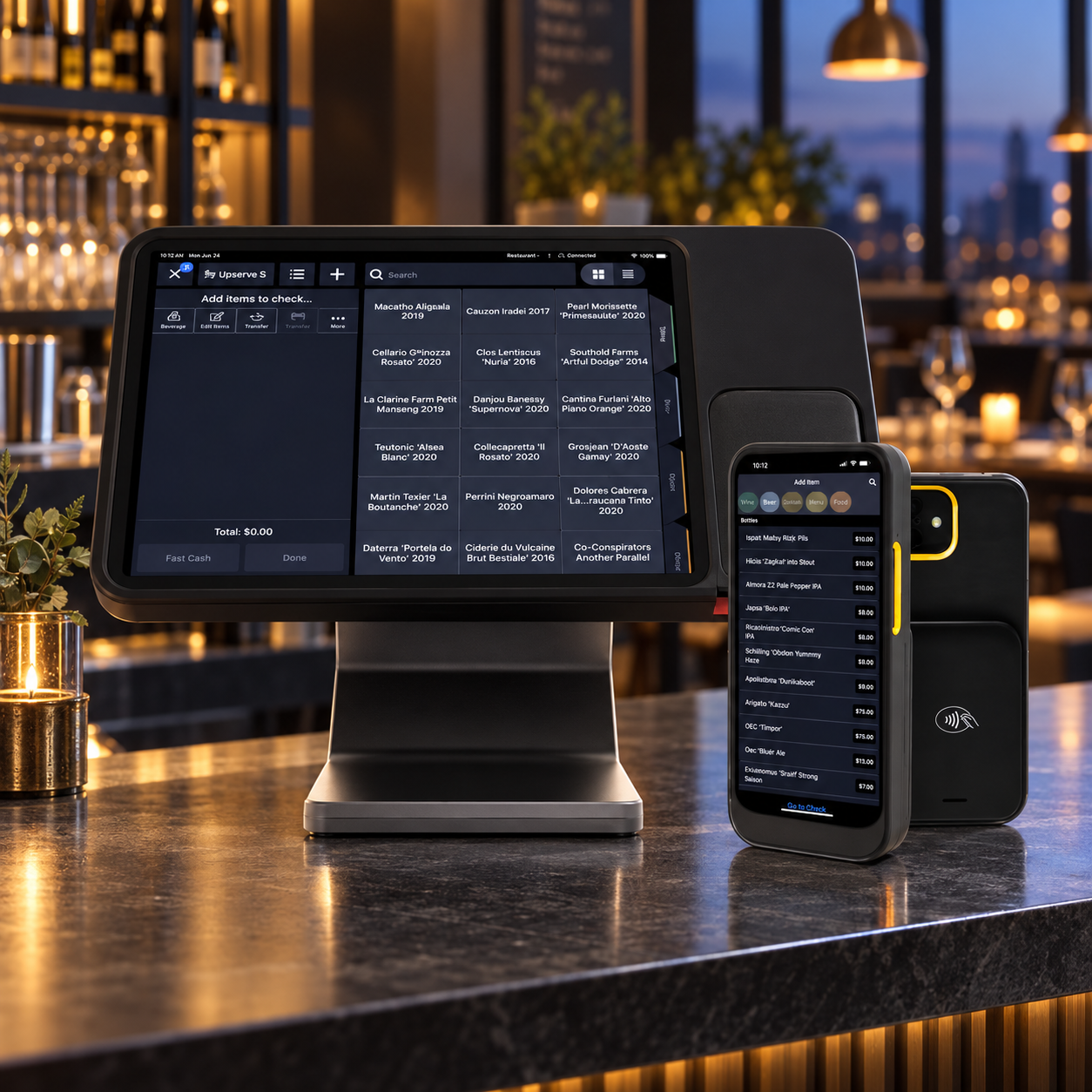 An Upserve POS terminal on the pass, with plated dishes going out to the dining room
