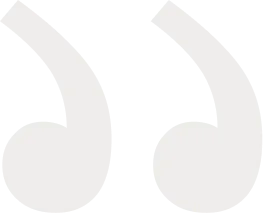 Large stylized white quotation marks on a light background.