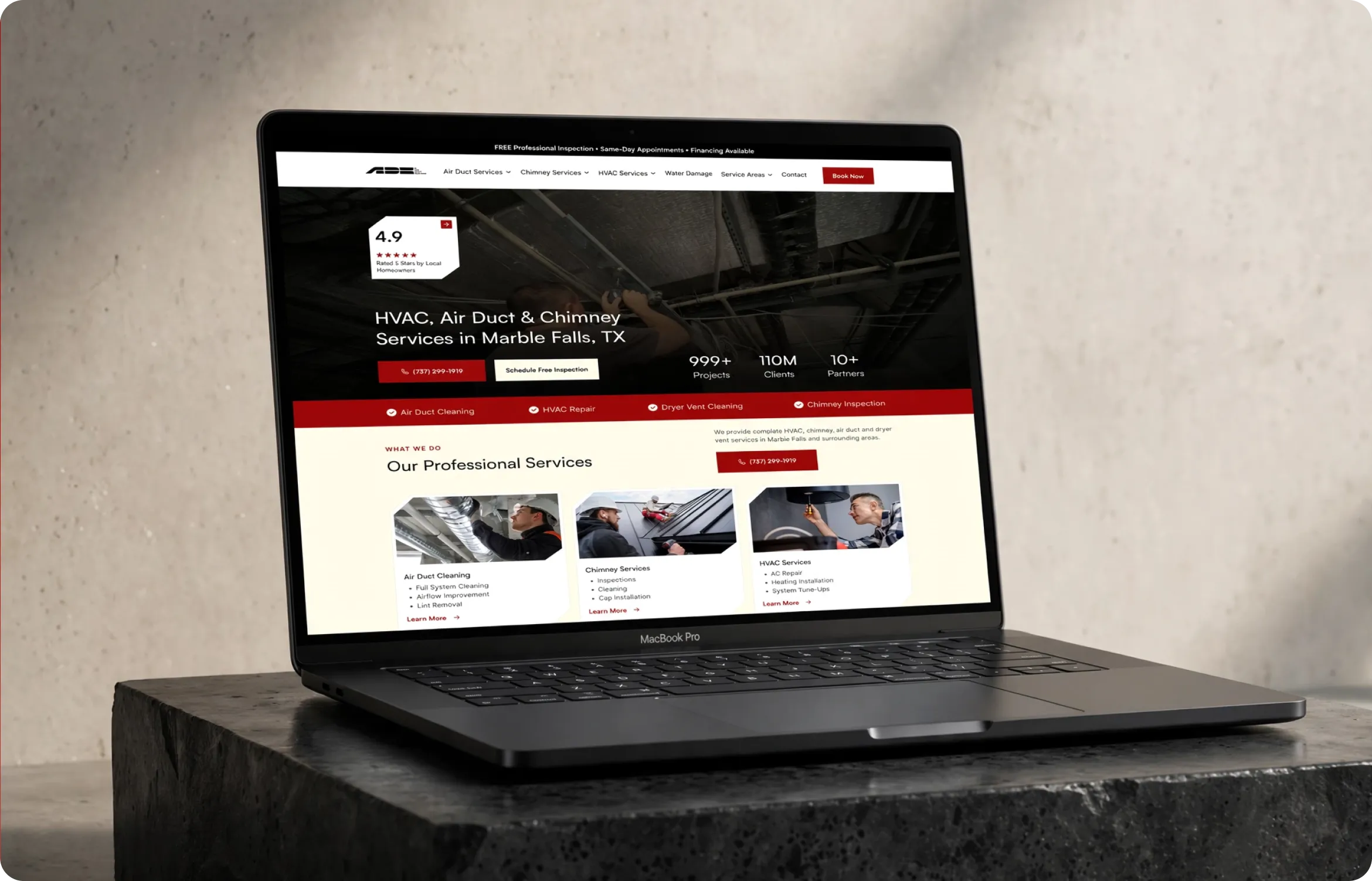 Laptop screen showing SpecBooks homepage with kitchen fixtures and featured product categories.