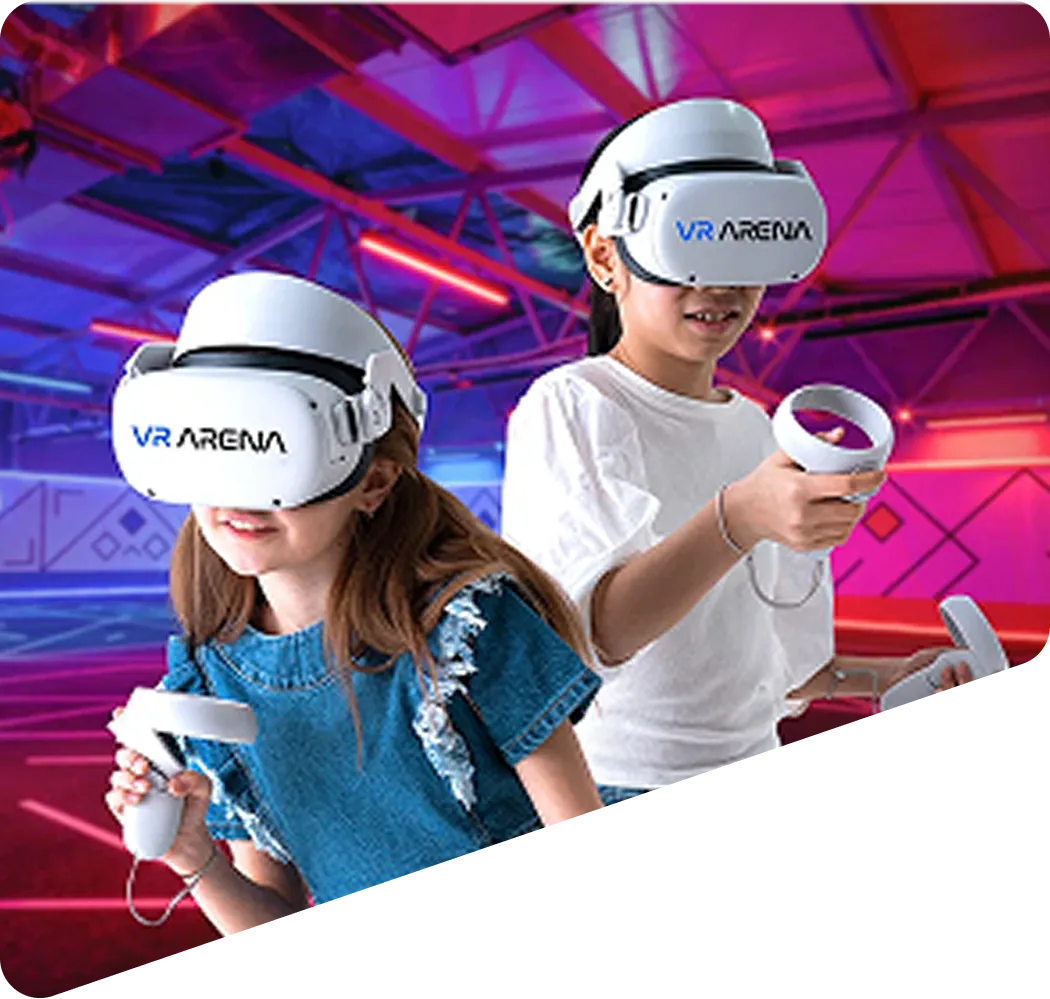 Two girls wearing white VR Arena headsets and holding controllers in a colorful virtual reality space.