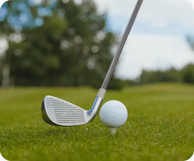 White golf ball on the grass of a golf course