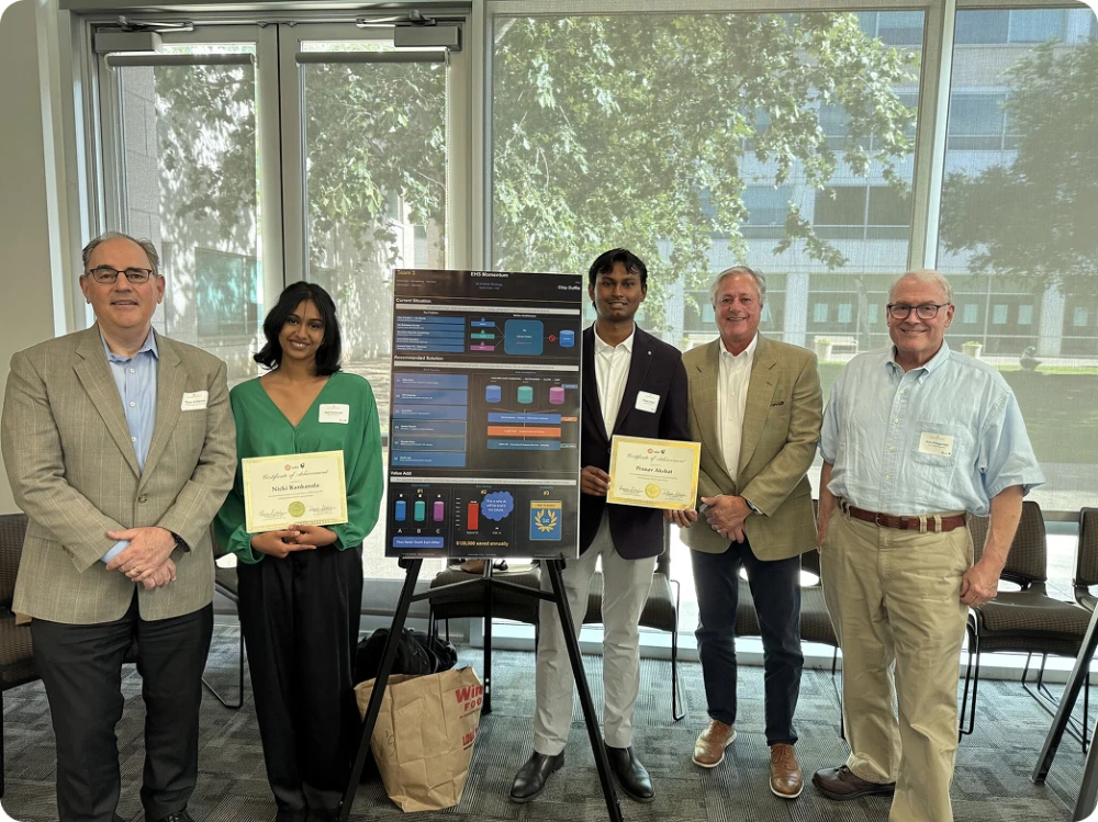 Smart Data Solutions team members with awards at a project showcase event