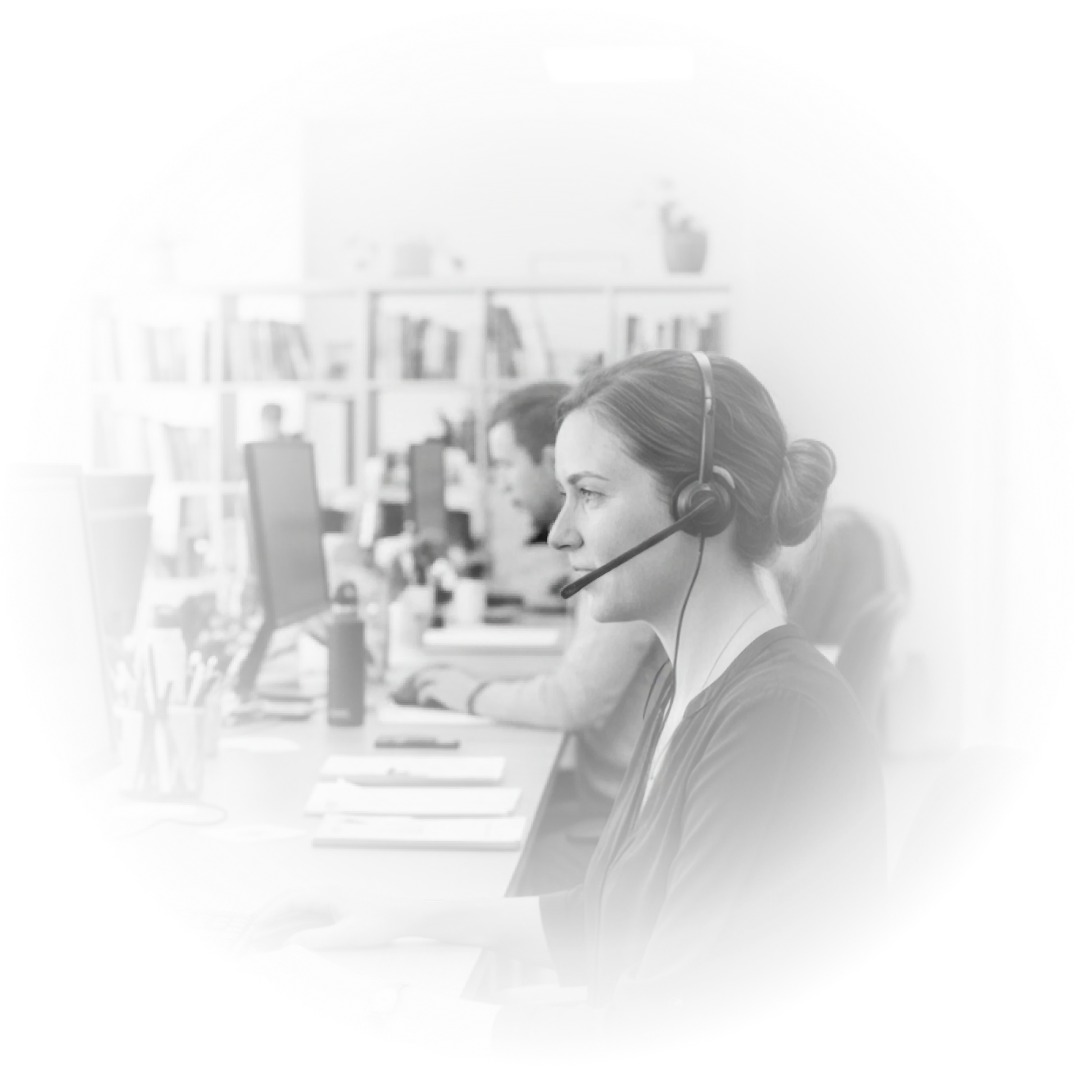 Customer support specialist wearing a headset at a workstation