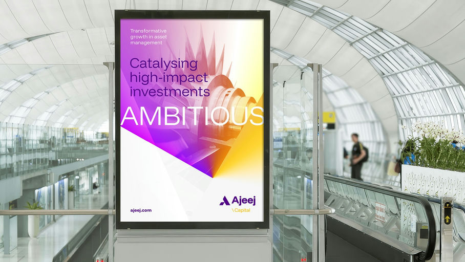 An Ajeej Capital airport poster reading Catalysing high-impact investments | Financial Services Brand Strategy and Architecture, Ajeej Capital