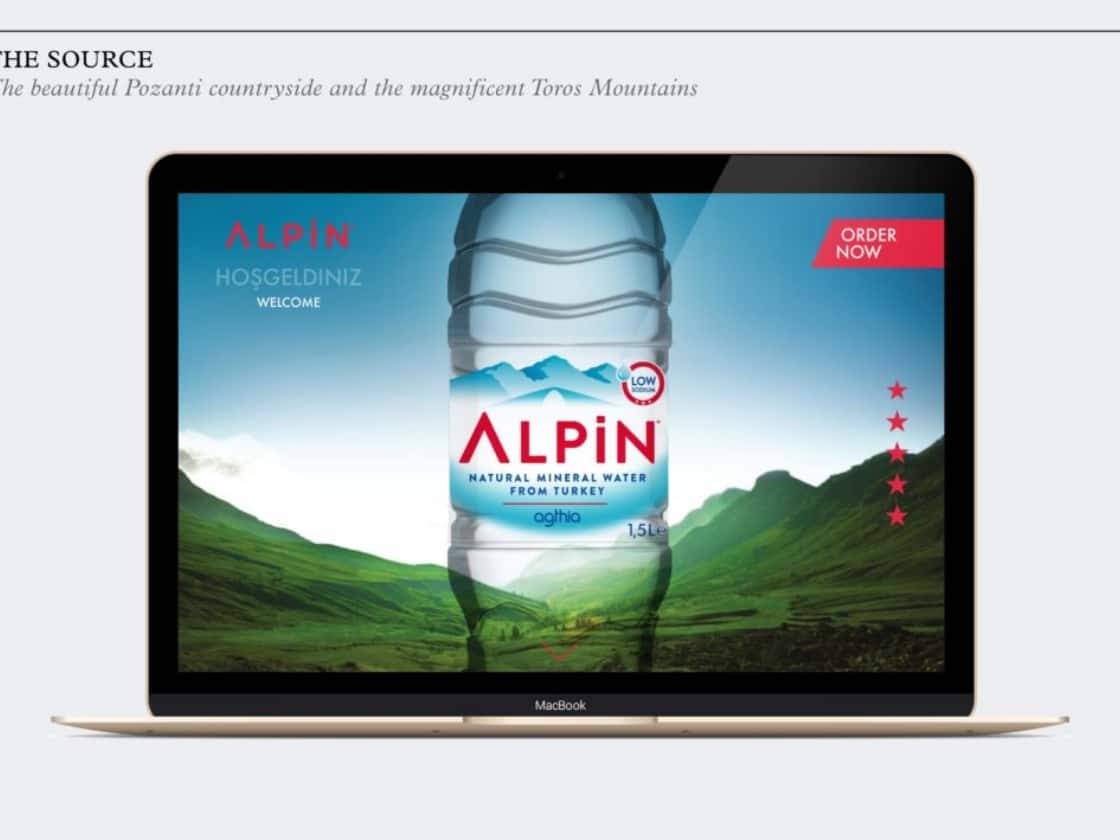 The Alpin website on a laptop, the bottle set against the Toros Mountains | Digital Design and Brand Development, Alpin Water