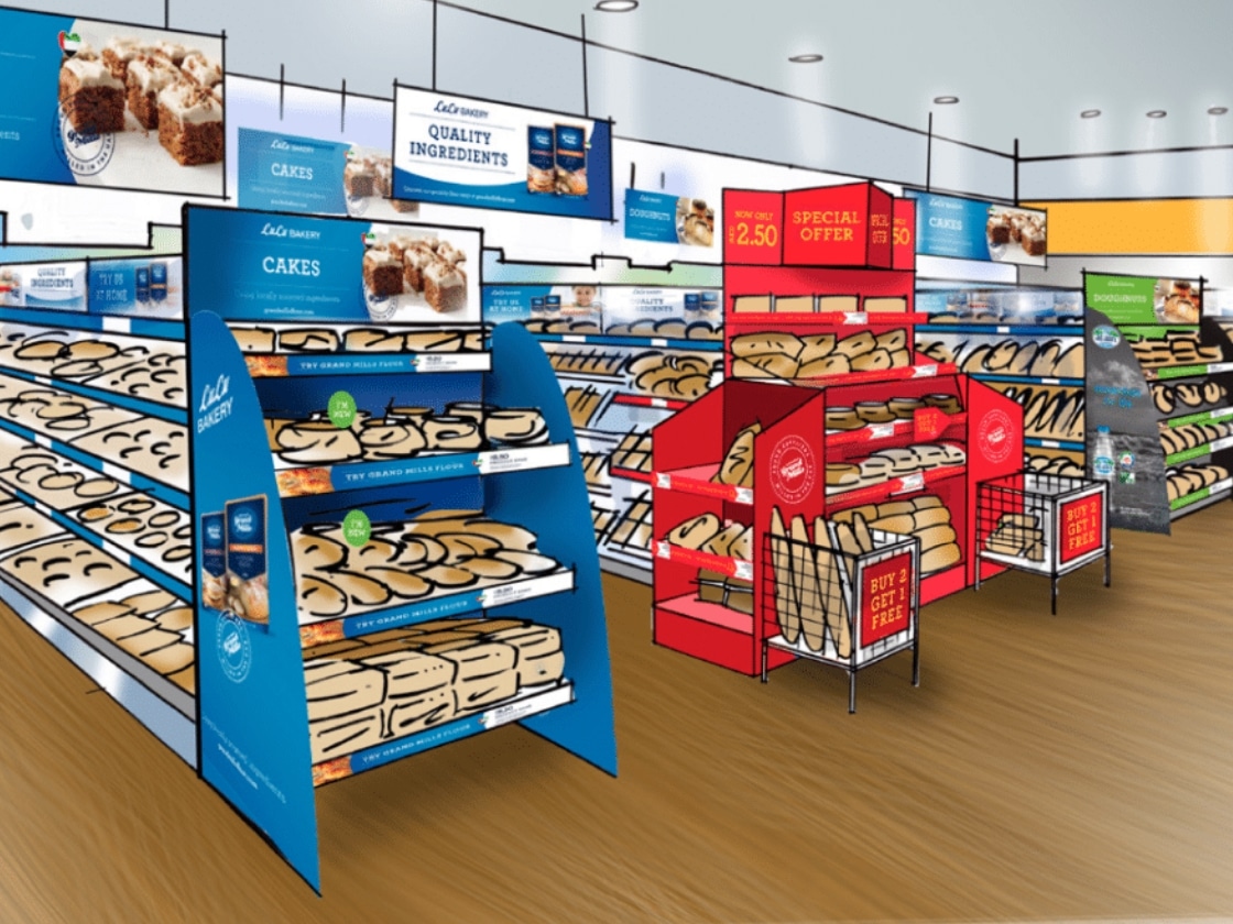 An in-store bakery aisle with branded shelf displays and promotional units | Retail Brand Experience and Environments, Grand Mills