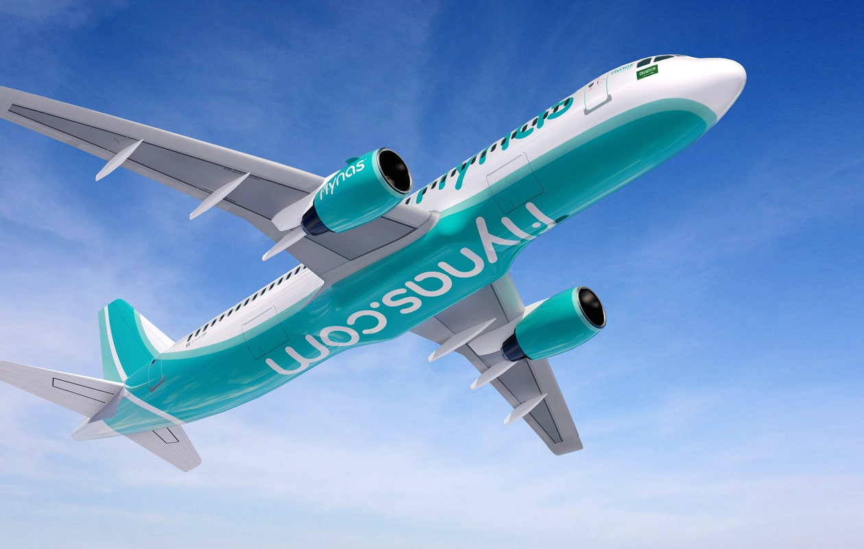 A flynas aircraft climbing against a blue sky in the teal and white livery | Airline Brand Identity and Brand Guidelines, flynas