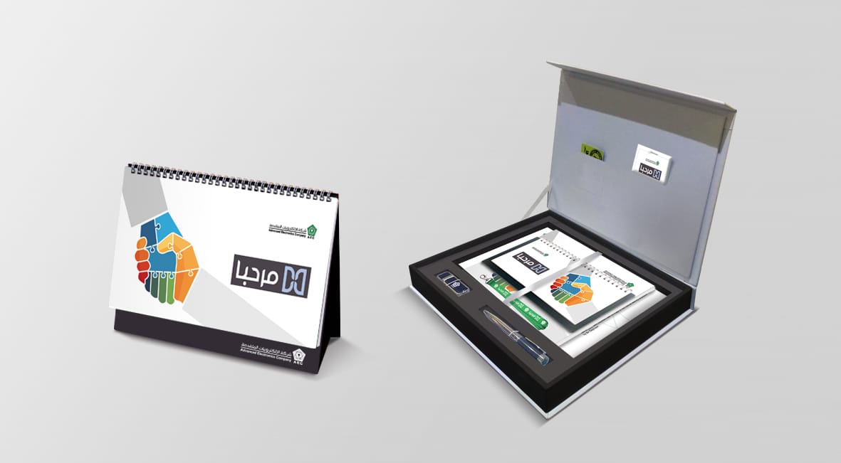 A Marhaba desk calendar beside a presentation box holding a tablet | Brand Creation and Internal Communications, Advanced Electronics Company