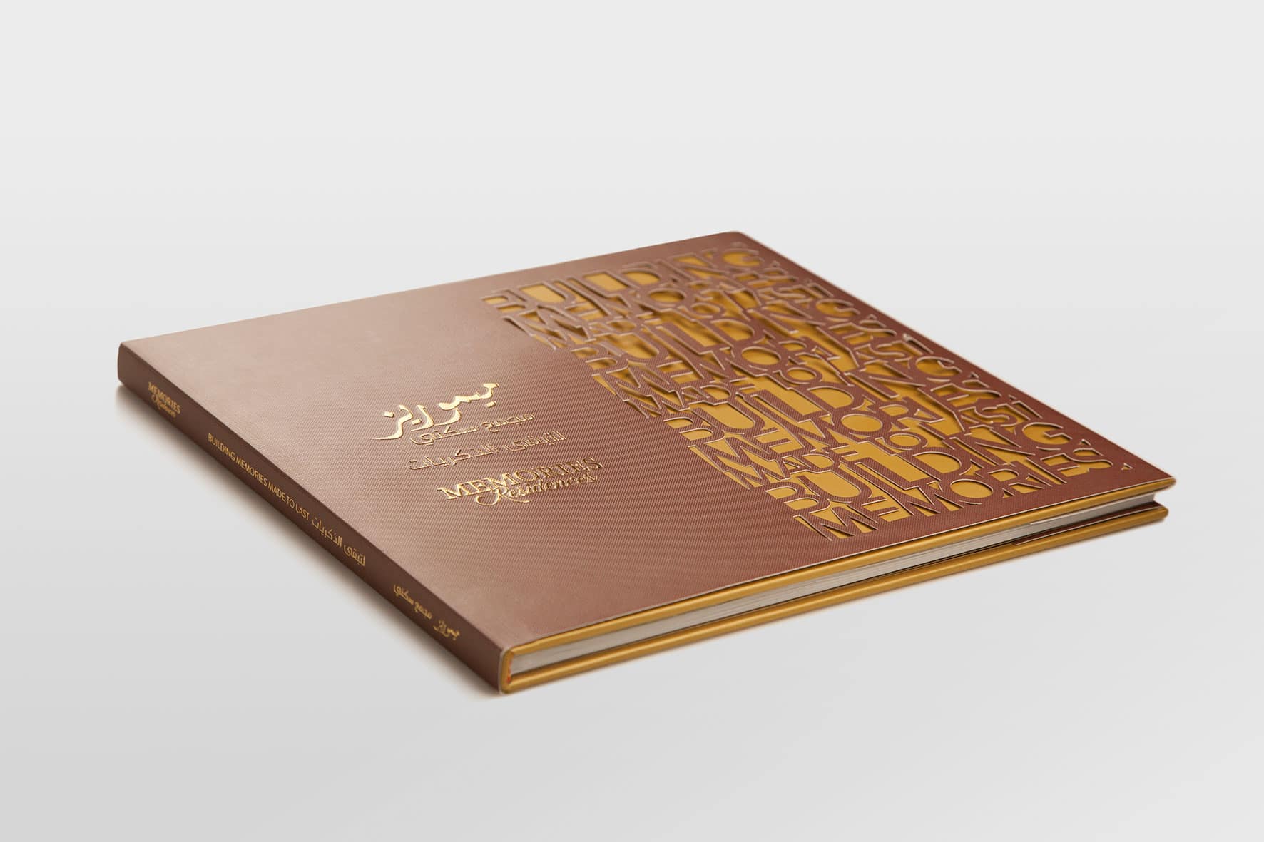 A copper foil brochure cover with Arabic calligraphy and an embossed pattern | Real Estate Brand Communications, Saudi Arabia