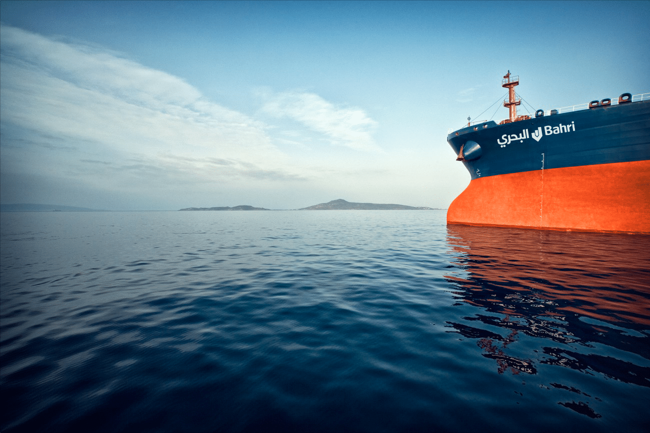 The orange and blue bow of a Bahri tanker on calm open sea | Maritime Brand Architecture and Visual Identity, Bahri