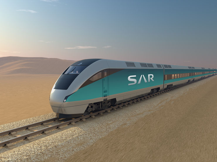 A Saudi Arabia Railways train in the SAR teal livery crossing open desert.