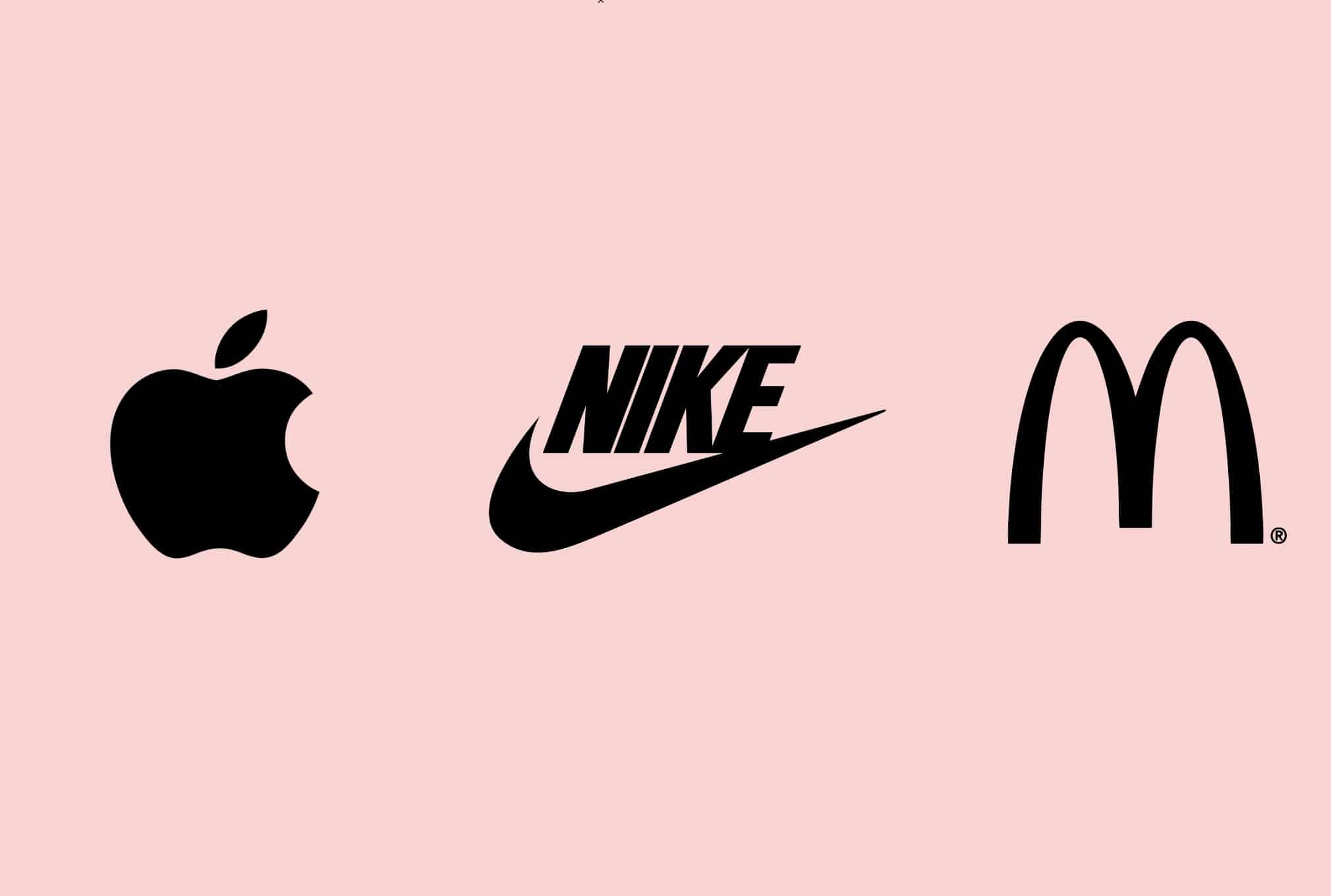 The Apple, Nike and McDonald's symbols side by side, three identities recognisable without a wordmark.