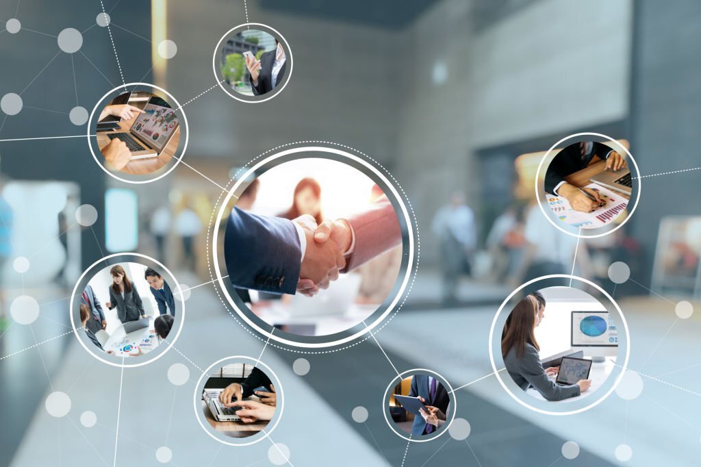 A business handshake at the centre of a network of linked photographs showing people working across industries.