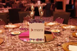 A set MEIRA awards dinner table with Iridium Advisors branded place cards.