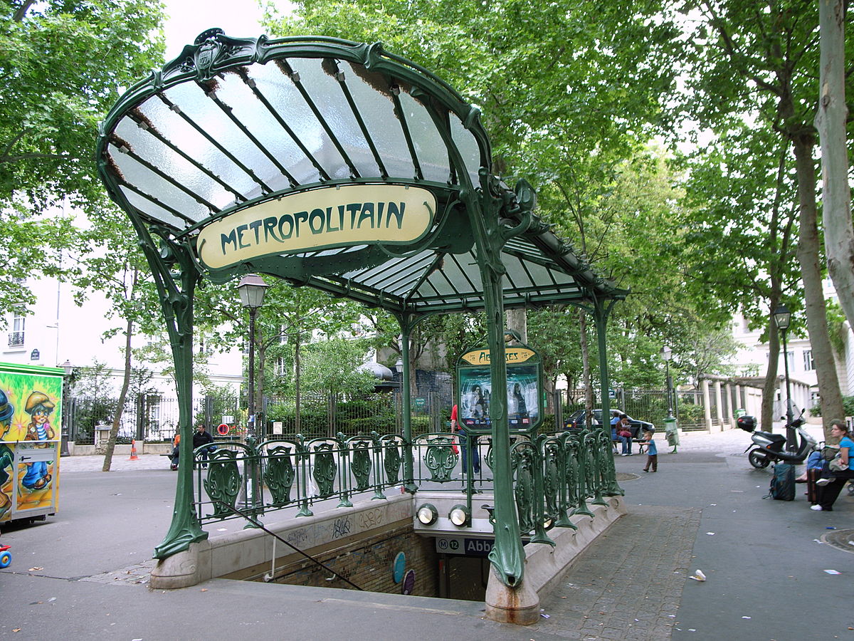 An art nouveau Metropolitain entrance canopy in Paris, with its distinctive green ironwork and lettering.