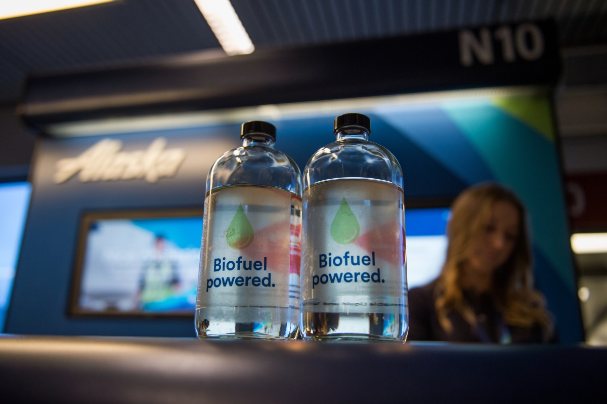 Two Biofuel powered water bottles on an Alaska Airlines gate desk at gate N10.