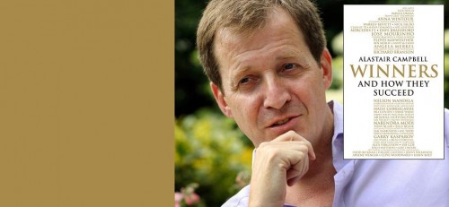 Alastair Campbell beside the cover of his book Winners and How They Succeed.