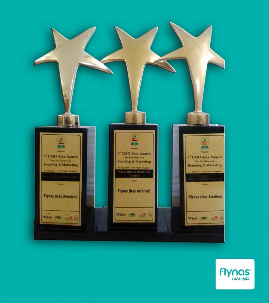 Three gold star trophies from the CMO Asia Awards, won by flynas for branding and marketing.