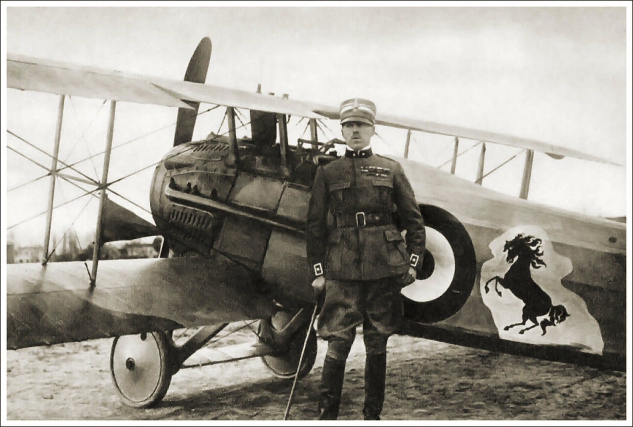 Francesco Baracca beside his SPAD biplane, the prancing horse on its fuselage that Ferrari adopted.