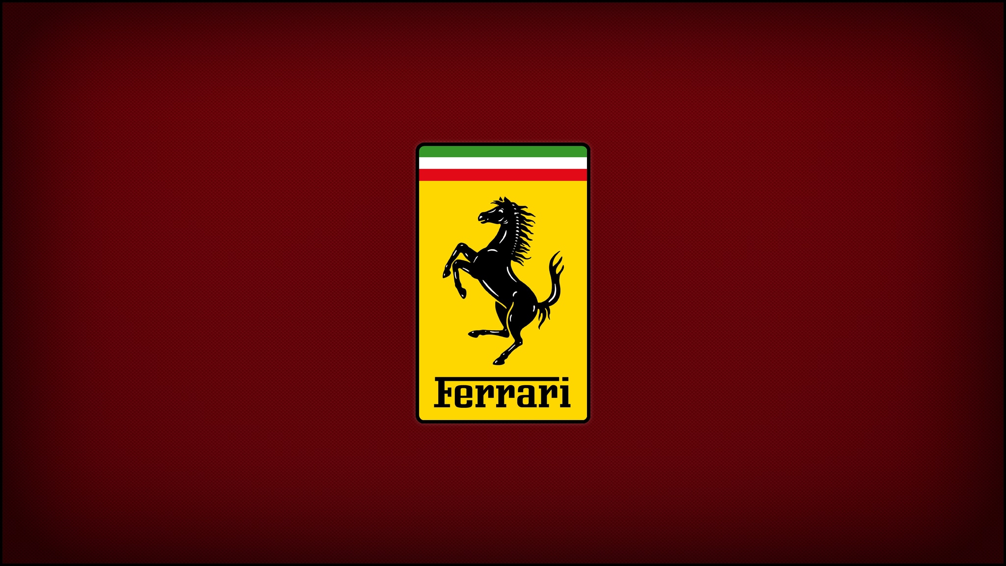 The Ferrari prancing horse badge in yellow and black on a deep red field.