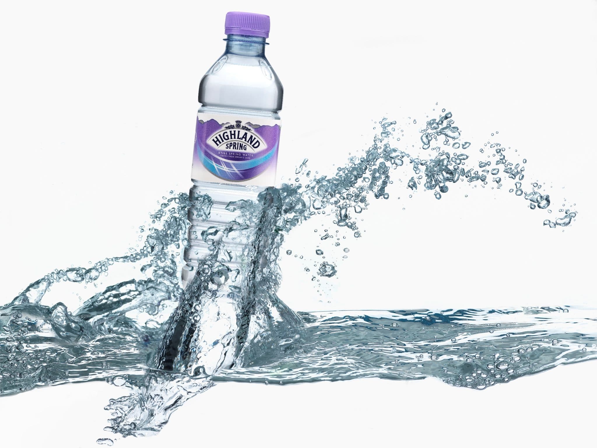 A Highland Spring bottle photographed against a splash of water.