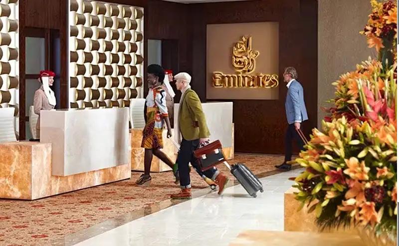 Emirates First private check-in demonstrating premium travel branding and connected customer experience.