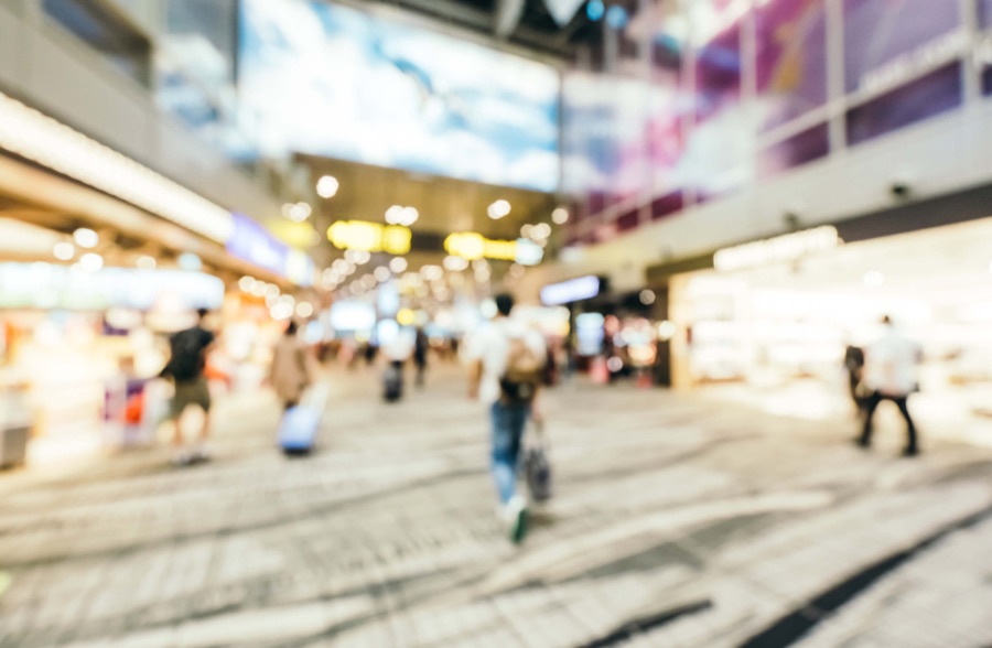 Shoppers moving through a busy retail mall concourse | Consumer Brands and Retail