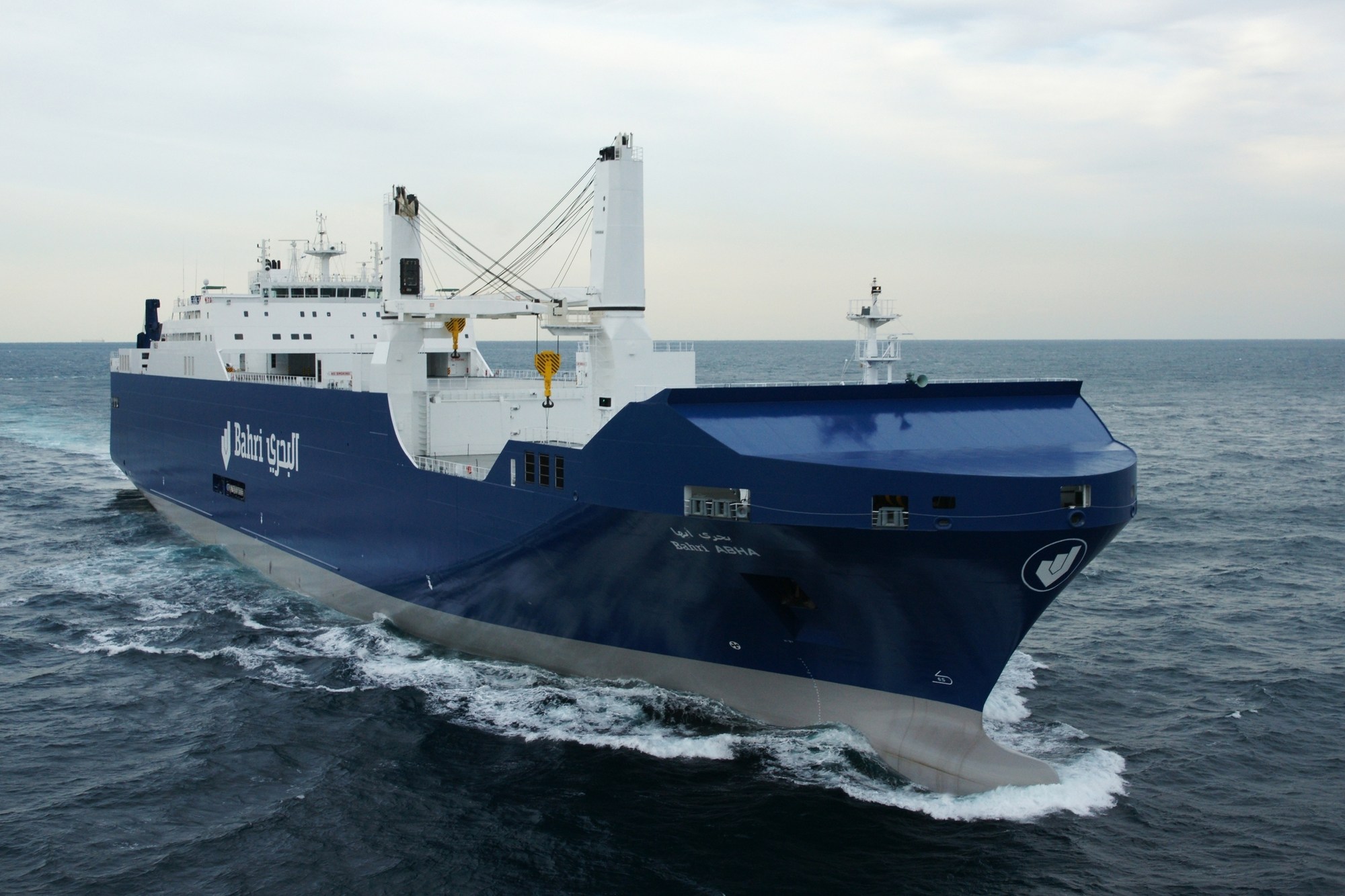 A Bahri vessel under way bow-on across open sea, its blue hull carrying the bilingual Bahri wordmark | Maritime, Transportation & Logistics