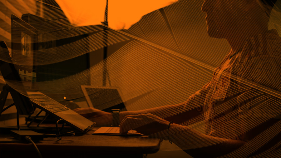 Person working on a laptop at dusk, symbolizing a healthcare company's fast CJA migration and analytics recovery