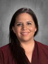 Leah Macias smiling in a staff portrait photo