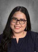 Lola Rodriguez smiling in a staff portrait photo
